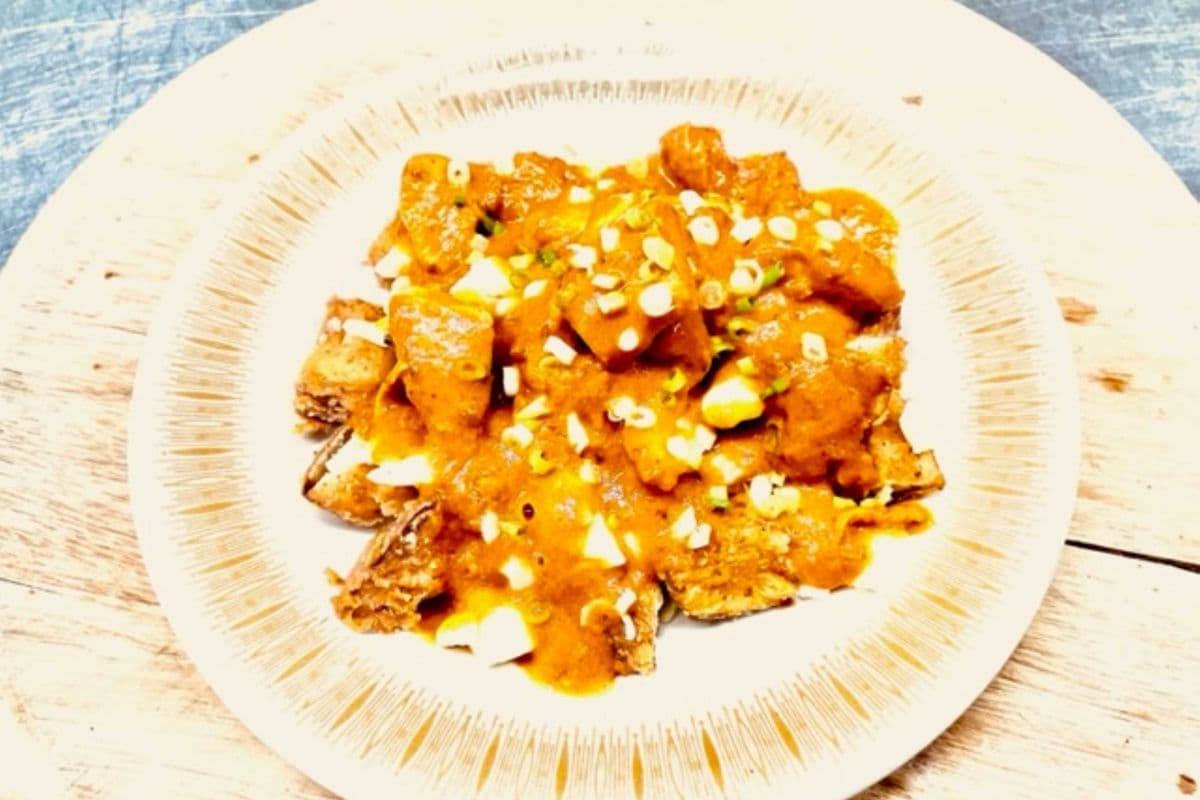 DCS BUTTER CHICKEN POUTINE $18