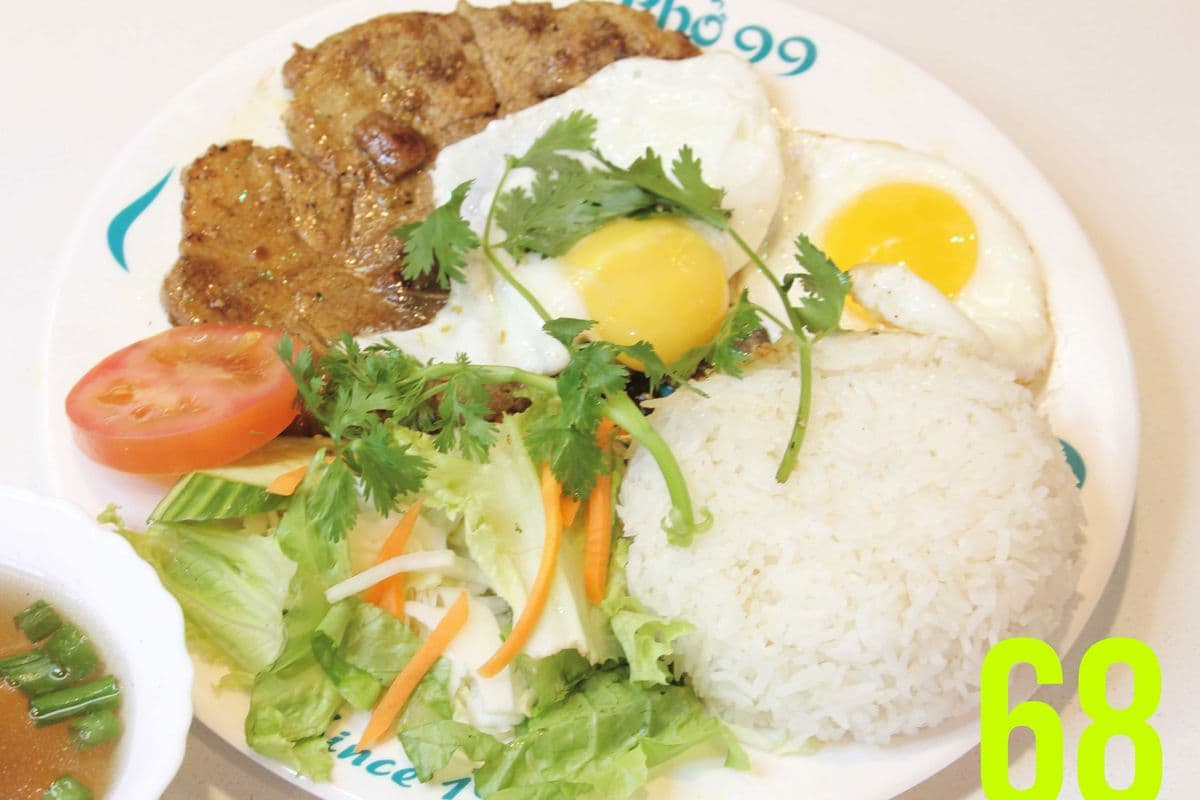 68. Two Sunny-Side Up Eggs with Gilled Lemongrass Pork Chops on Rice