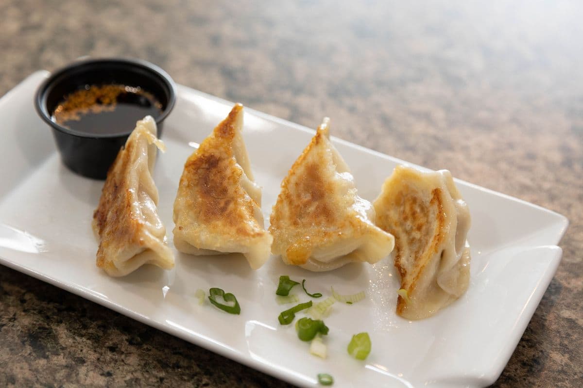D2. Pork and Celery Dumplings Pot Sticker (12 pcs)