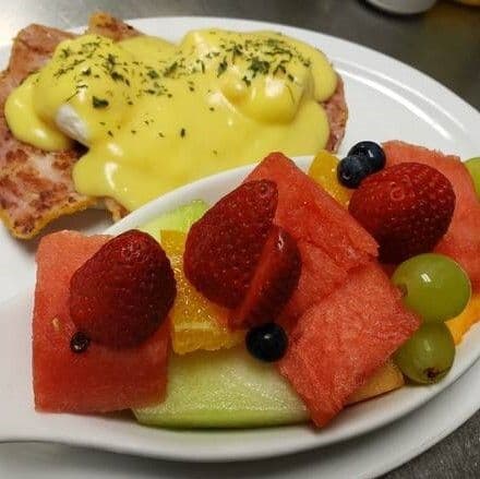 Eggs Benedict with Peameal and Fruit