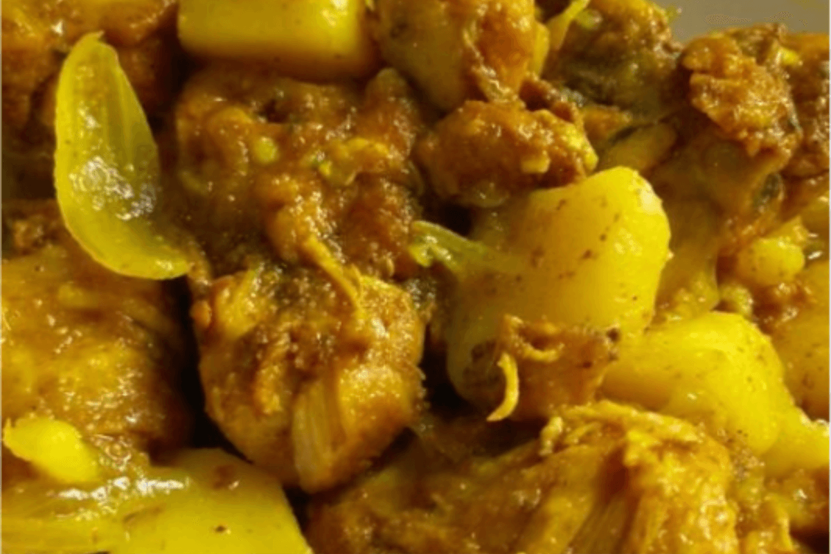 Curry Chicken served with Rice and Pea