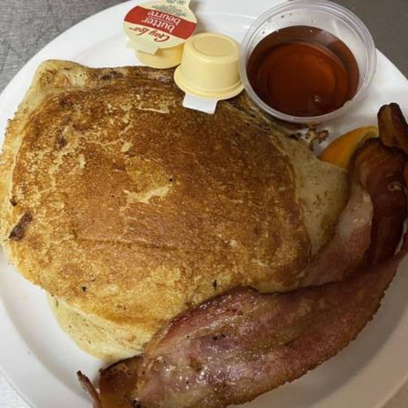 Kids Pancakes Served with Maple Syrup and Butter
