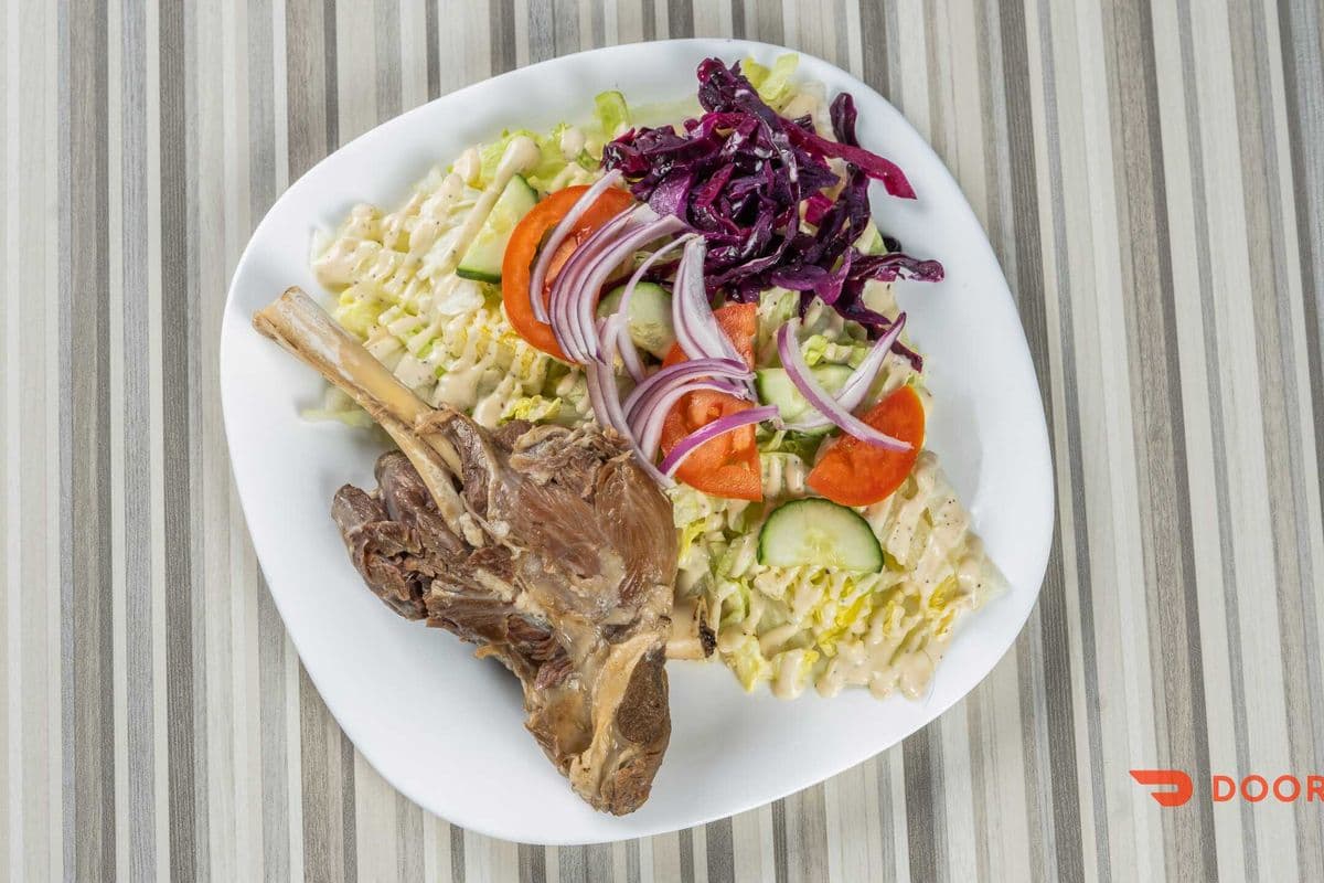 Lamb Shank with Salad and Naan