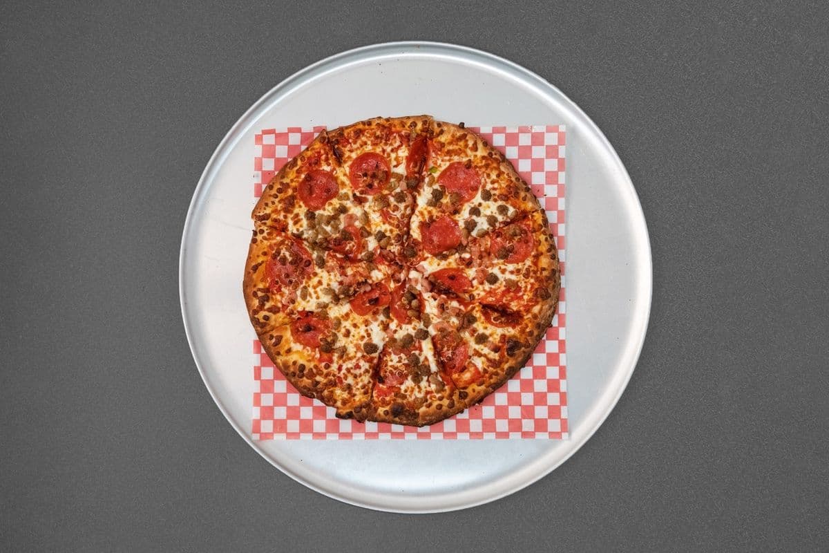 Meat Lovers Speciality Pizza w/ one free creamy garlic dip