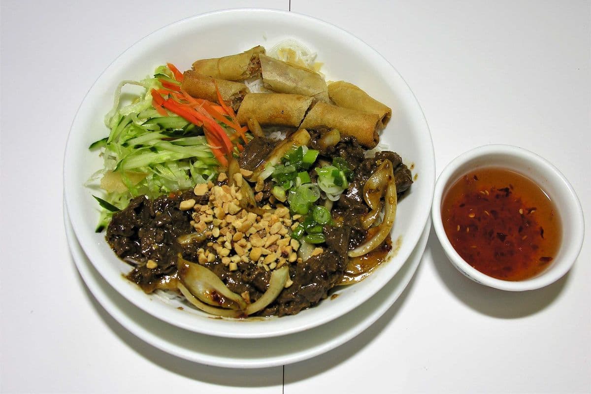 19. Vermicelli with Satay Beef and Spring Rolls "Replace Rice or vegetables Add $1.00"