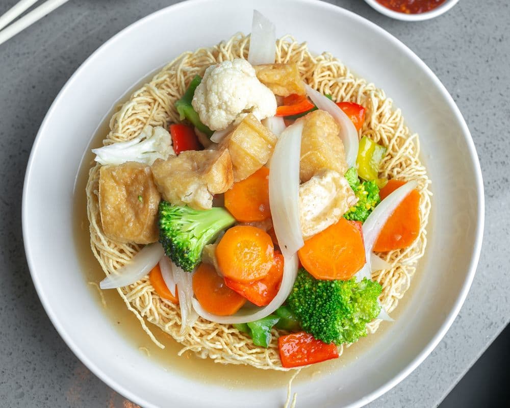 V35. Stir Fried Vegetables and Tofu on Crispy Egg Noodle Nest