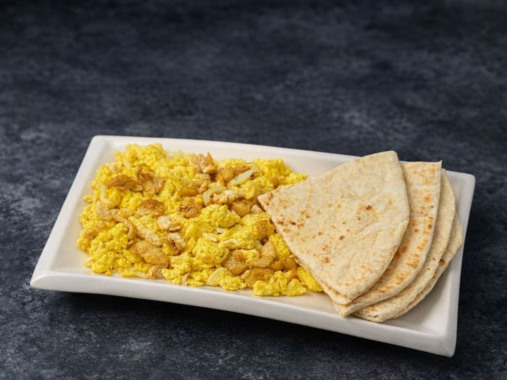 Fried Egg, Saltfish & Roti