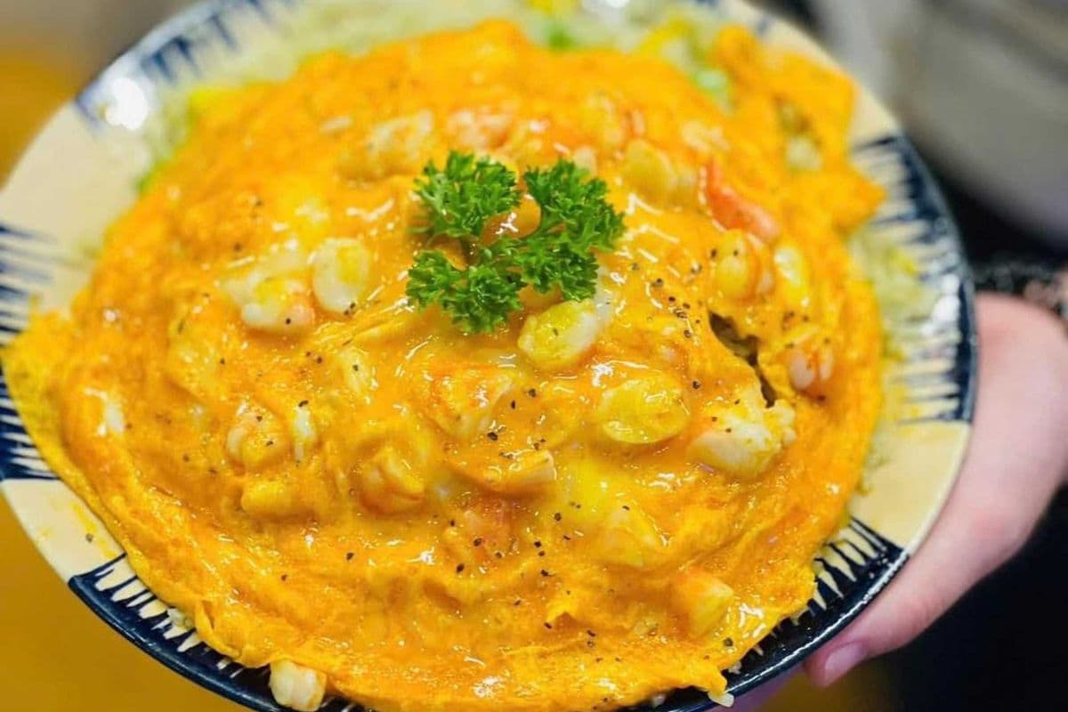 Shrimp Egg Rice Bowl (4 eggs, 6 shrimp, chicken fried rice, green onions, pickled carrots and cucumber)