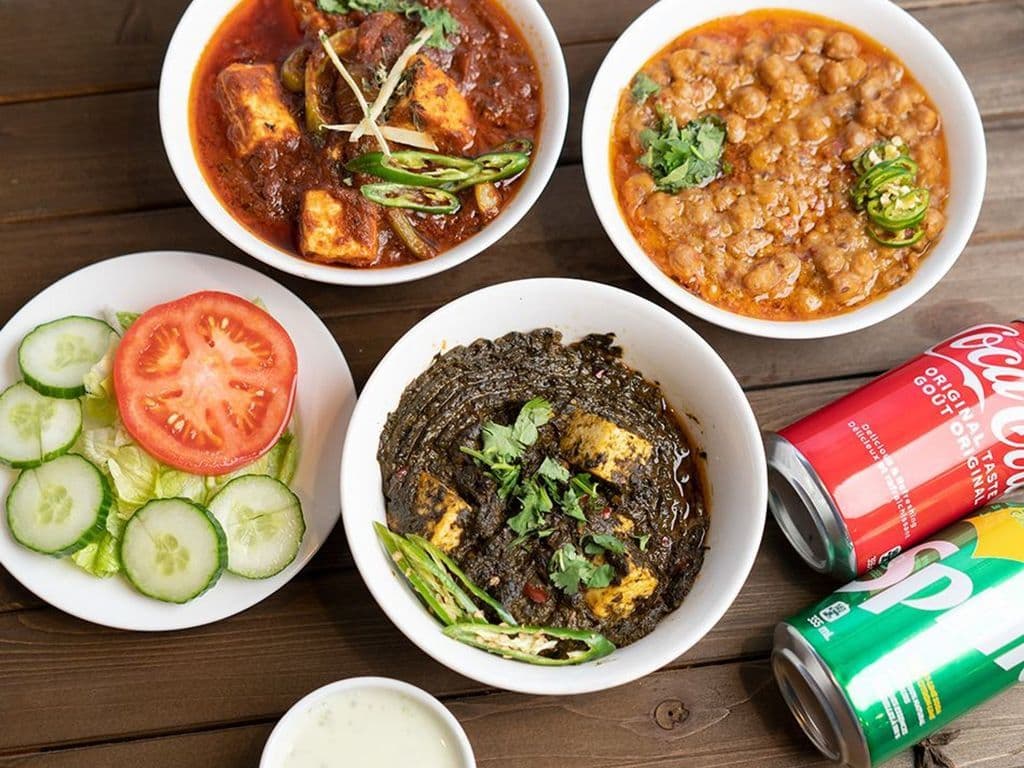 Veg Combo(Any 2 veg curries, 2 nan, 2 pop, salad, raita)
