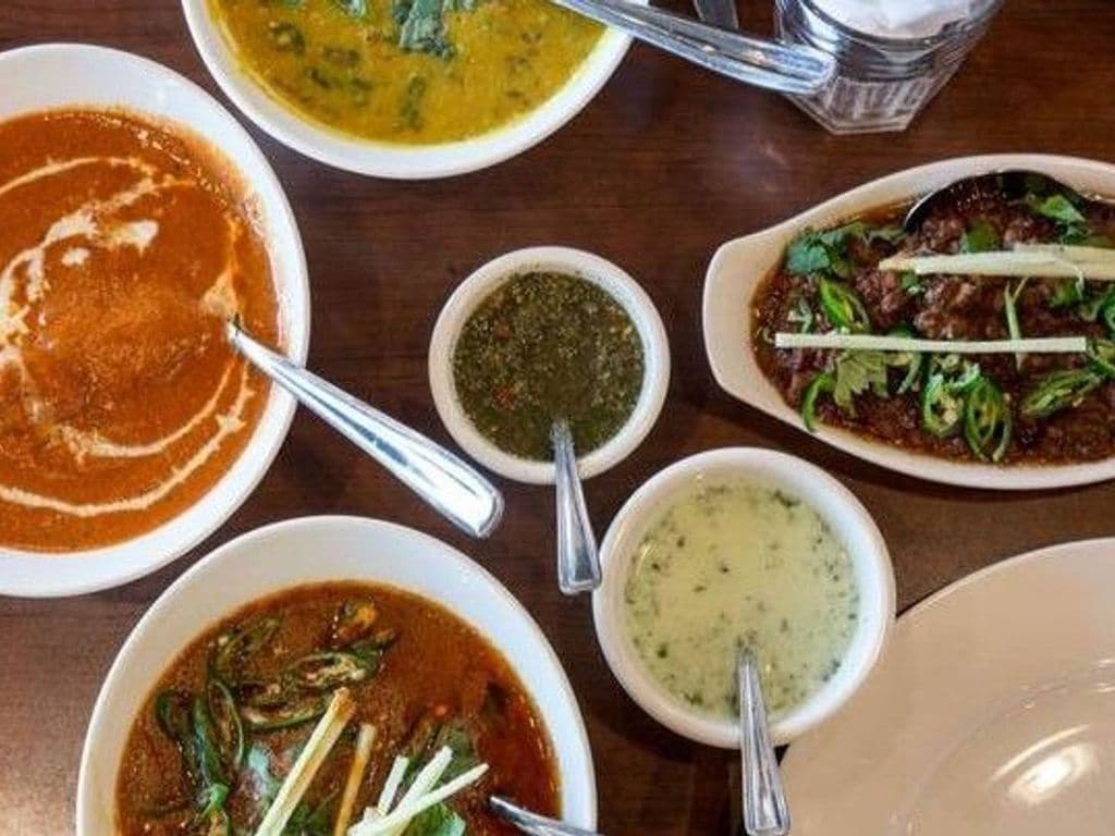 Curry Combo (Any 2 Non Veg curries, 2 nan, 2 pop, salad & raita)
