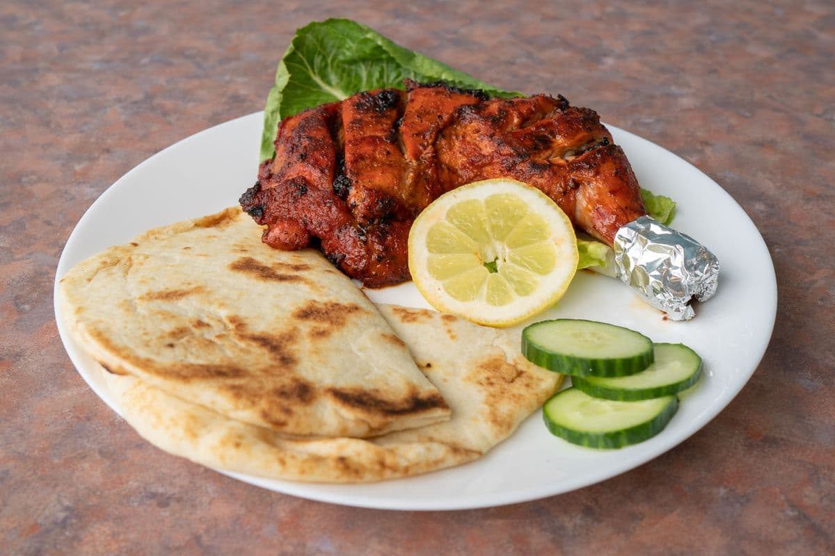 Tandoori Chicken (1 pc) Combo with 2 Parathas and canned pop