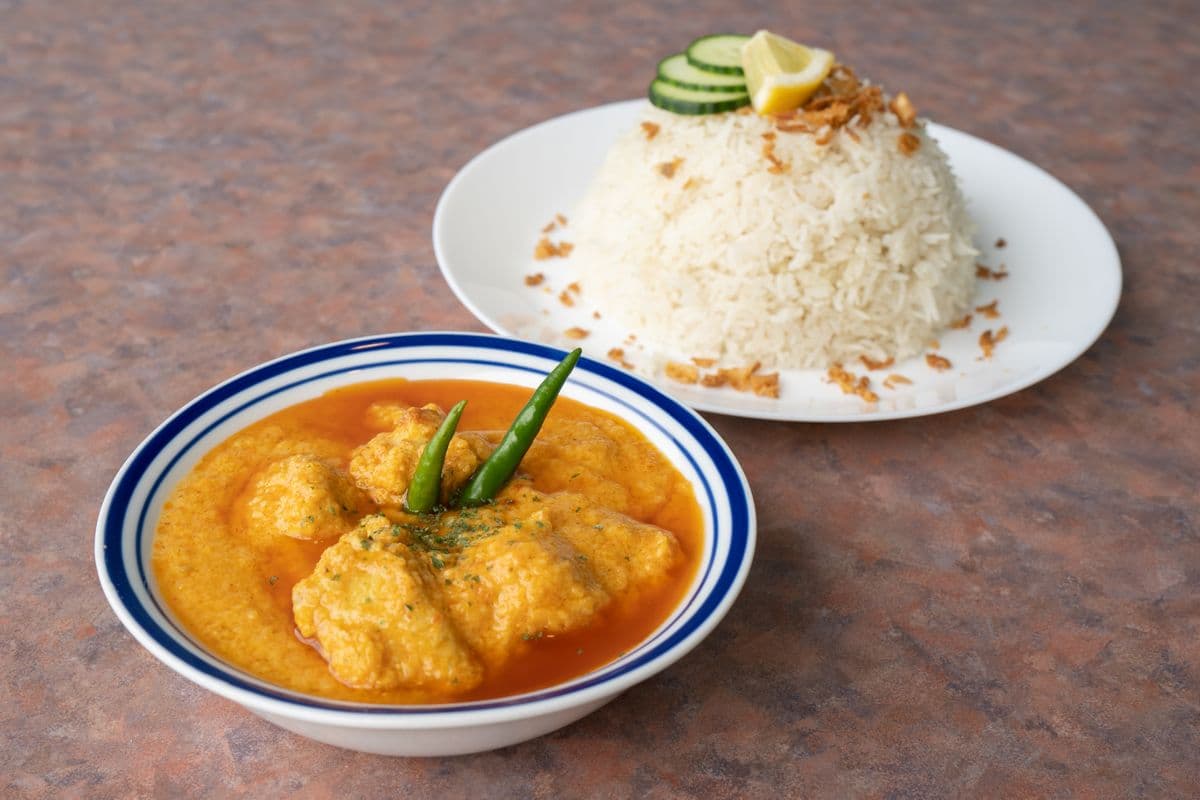 11. Butter Chicken with Rice (8oz cup)